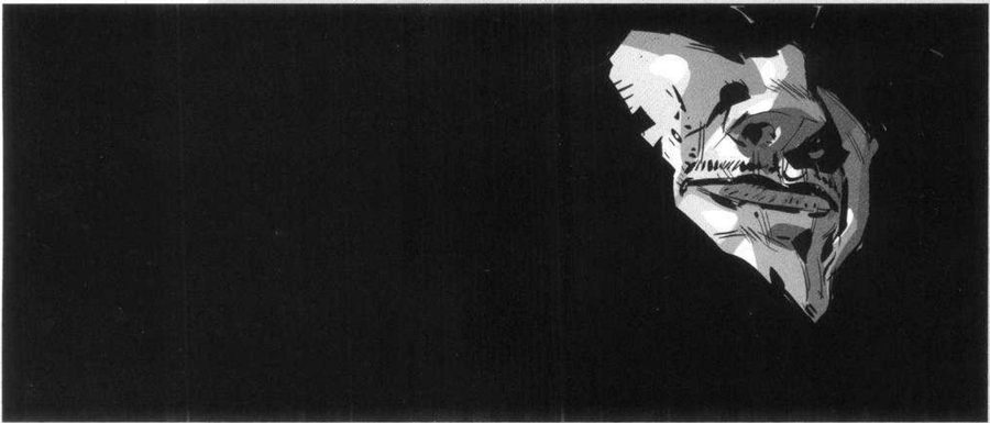 An all-black frame with a lit fragment of a face at the upper right.